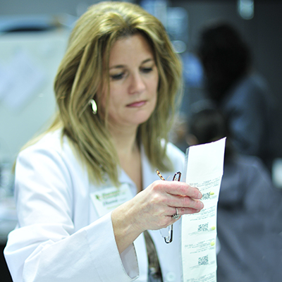 Pharmacist verifies PASS packaging