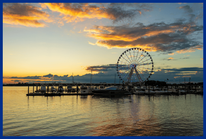 Photo of National Harbor, MD ferris wheel and dock at sunset