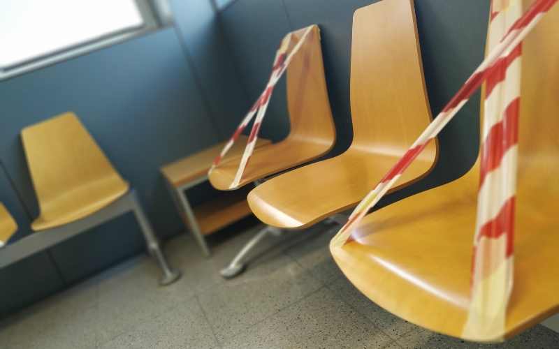 Chairs marked to enforce social distancing in a waiting area